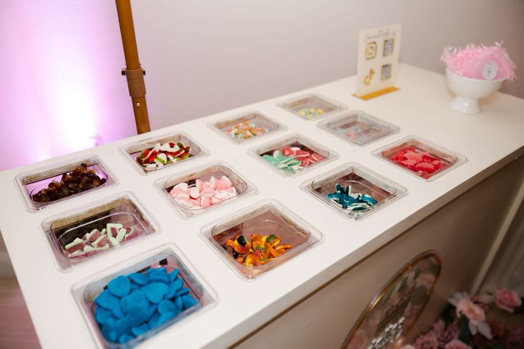 Colorful candy selection trays on the cart