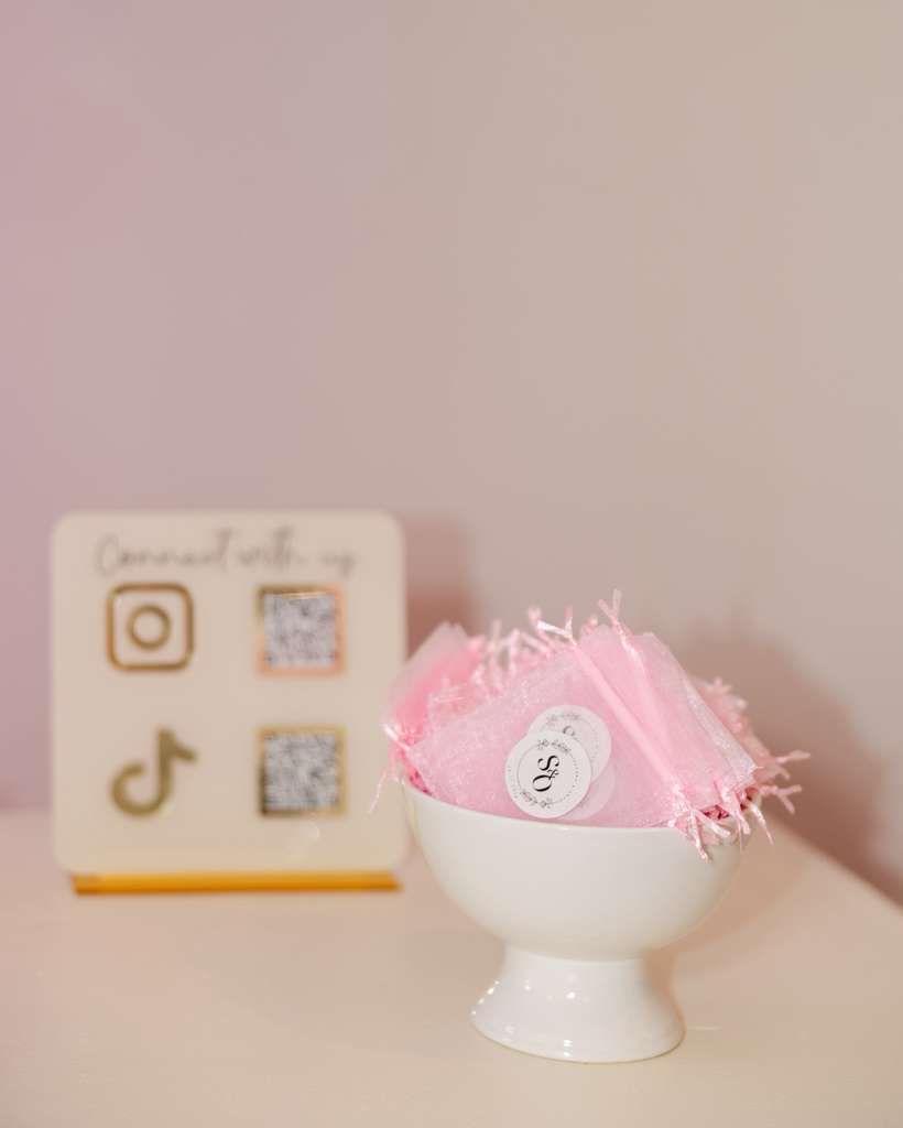 Pink candy gift bag with social media sign