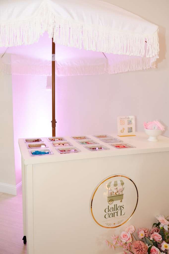 Dallas Cartl candy cart with umbrella and candy trays